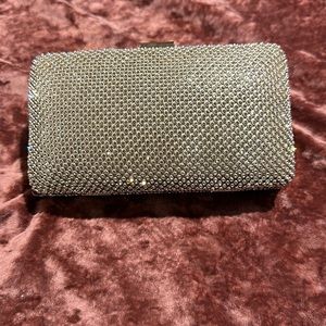 A rhinestone covered clutch